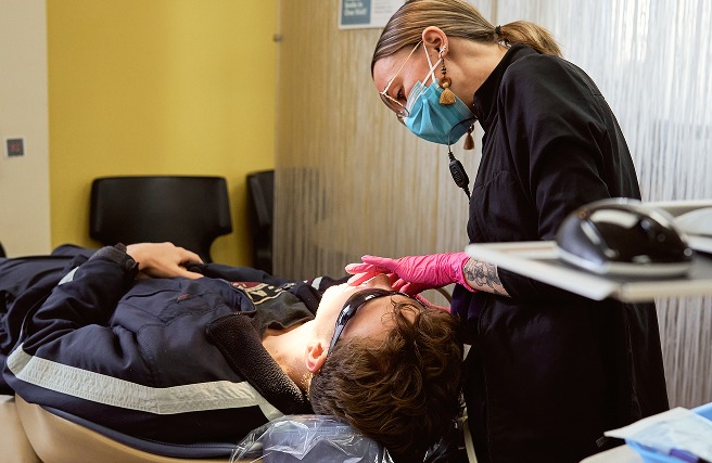Orthodontist examining a child during a two-phase orthodontic treatment appointment at Team Orthodontics.